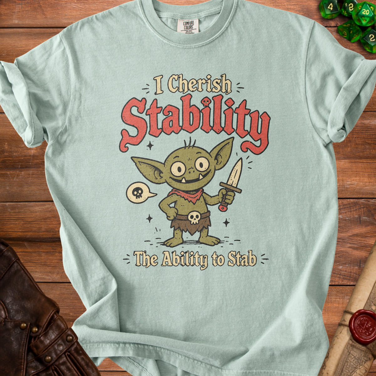 T-shirt with a goblin character holding a knife and the text "I Cherish Stability = The Ability to Stab".