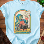 Light blue t-shirt with a goblin brewing potion under a rainbow arch.