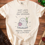 Cream t-shirt with a ghost holding a spoon and cup, saying "Not Lazy, Just Low on Spoons".