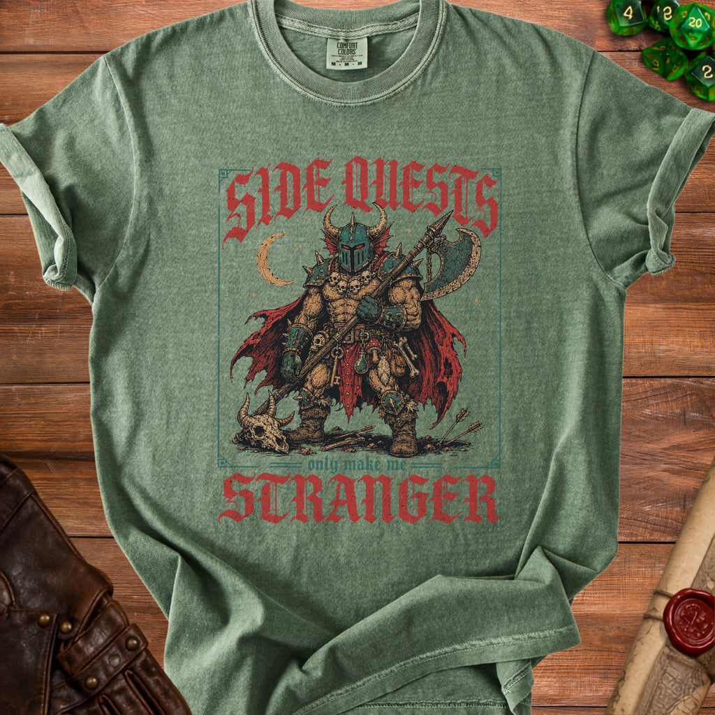Green t-shirt with "SIDE QUESTS only make me STRANGER" text and fantasy warrior graphic.