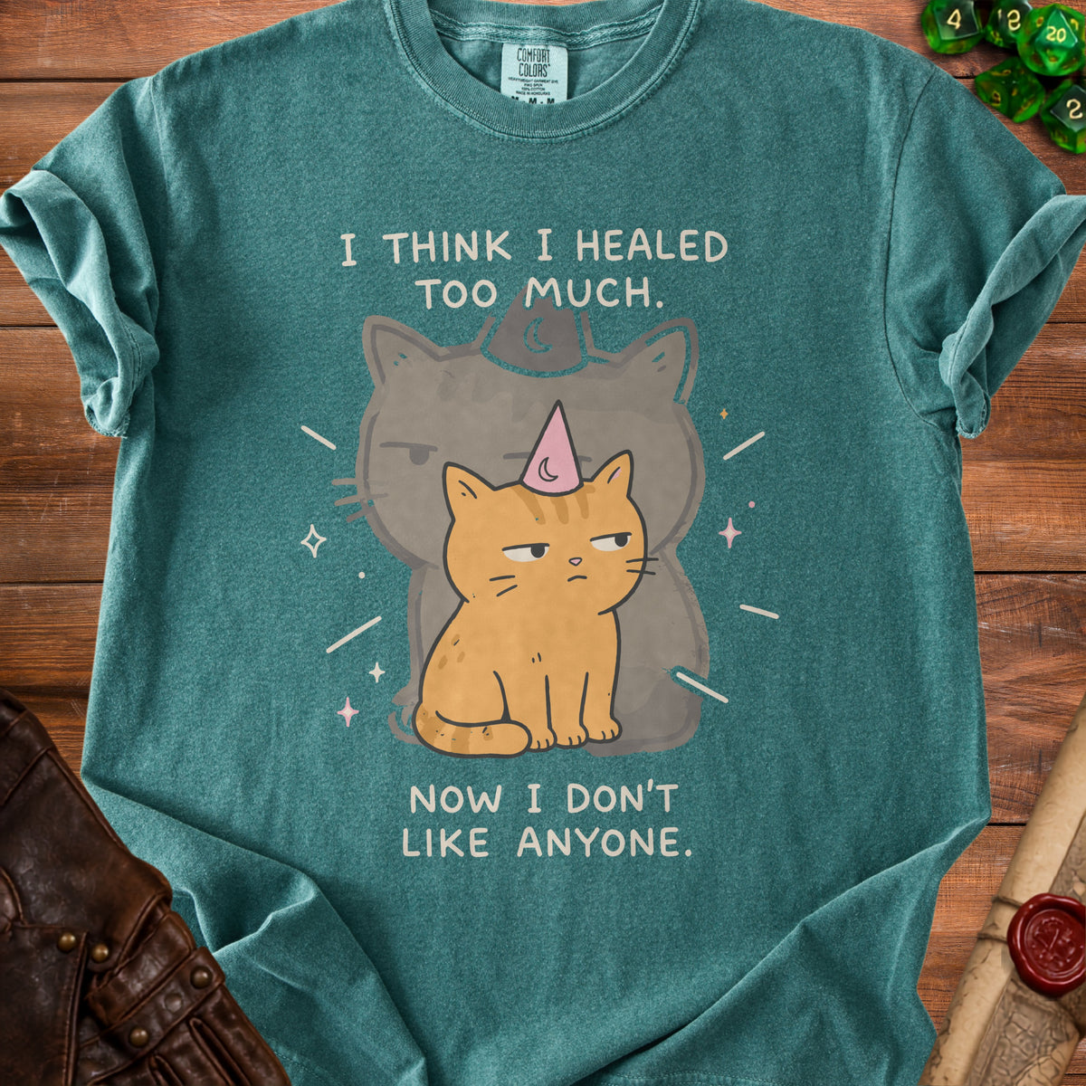 Teal t-shirt with two cats and text "I THINK I HEALED TOO MUCH. NOW I DON'T LIKE ANYONE."