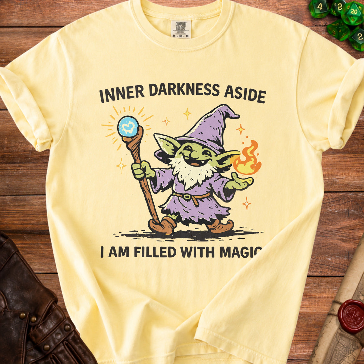 Yellow t-shirt with a goblin wizard graphic and text "Inner Darkness Aside, I Am Filled With Magic".
