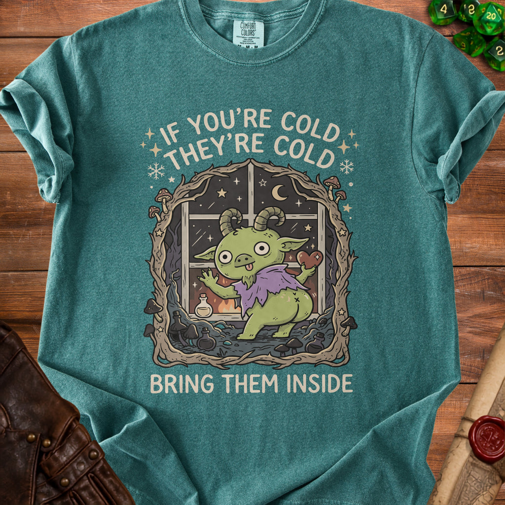 Green t-shirt with goblin artwork and text "If you're cold they're cold bring them inside".