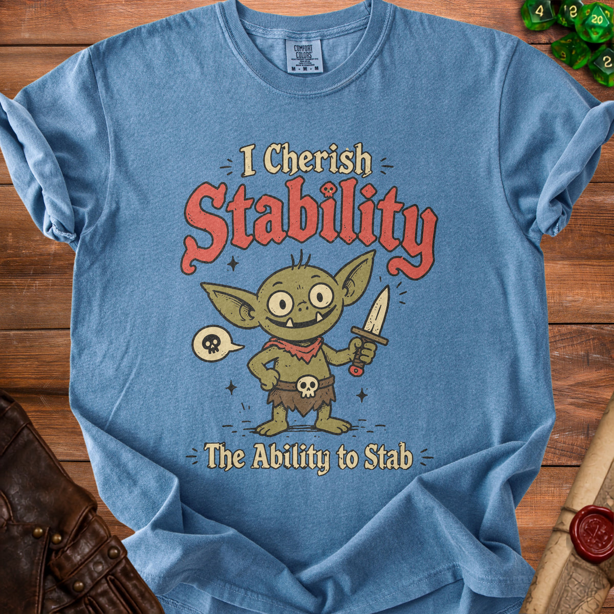 Blue t-shirt with a goblin holding a sword and text "I Cherish Stability - The Ability to Stab".