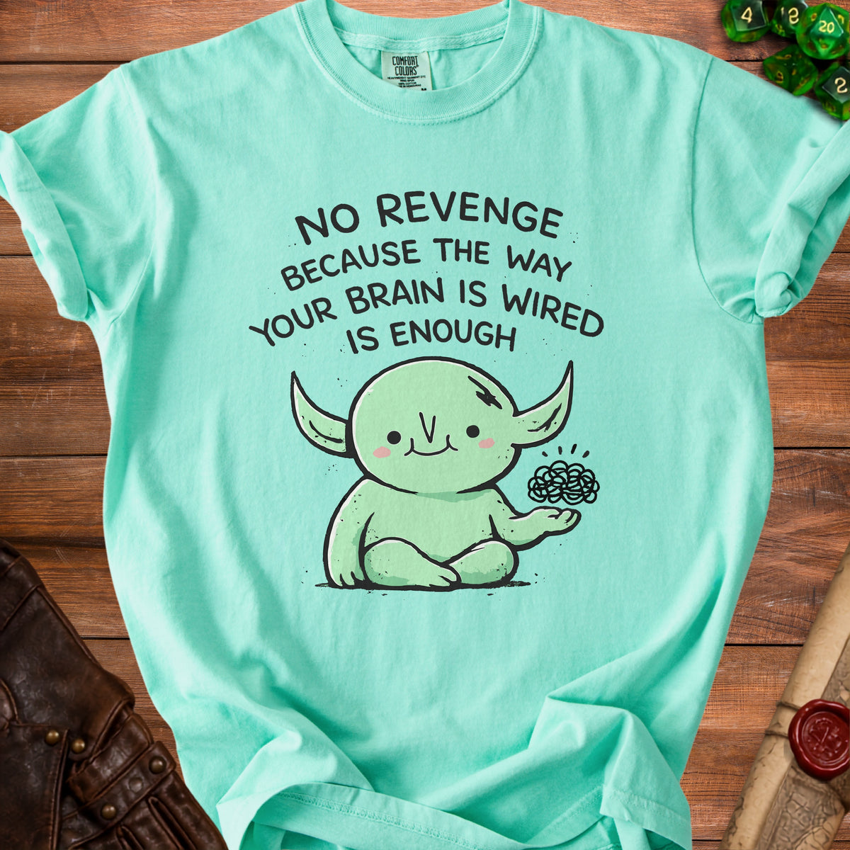 Teal t-shirt with cartoon creature and text "No Revenge Because The Way Your Brain Is Wired Is Enough".
