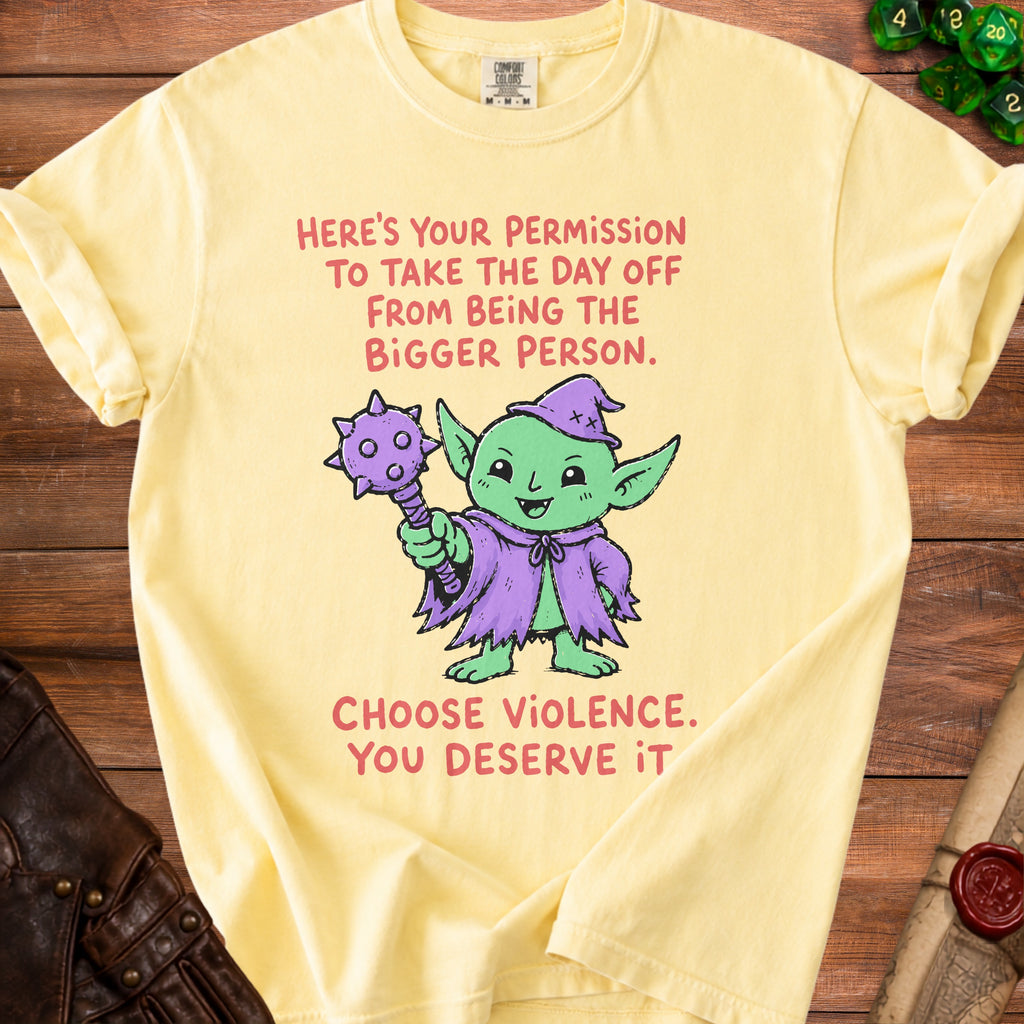 Yellow t-shirt with a goblin graphic and text reading "Here's your permission to take the day off from being the bigger person. Choose violence. You deserve it."