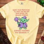 Yellow t-shirt with a goblin graphic and text reading "Here's your permission to take the day off from being the bigger person. Choose violence. You deserve it."
