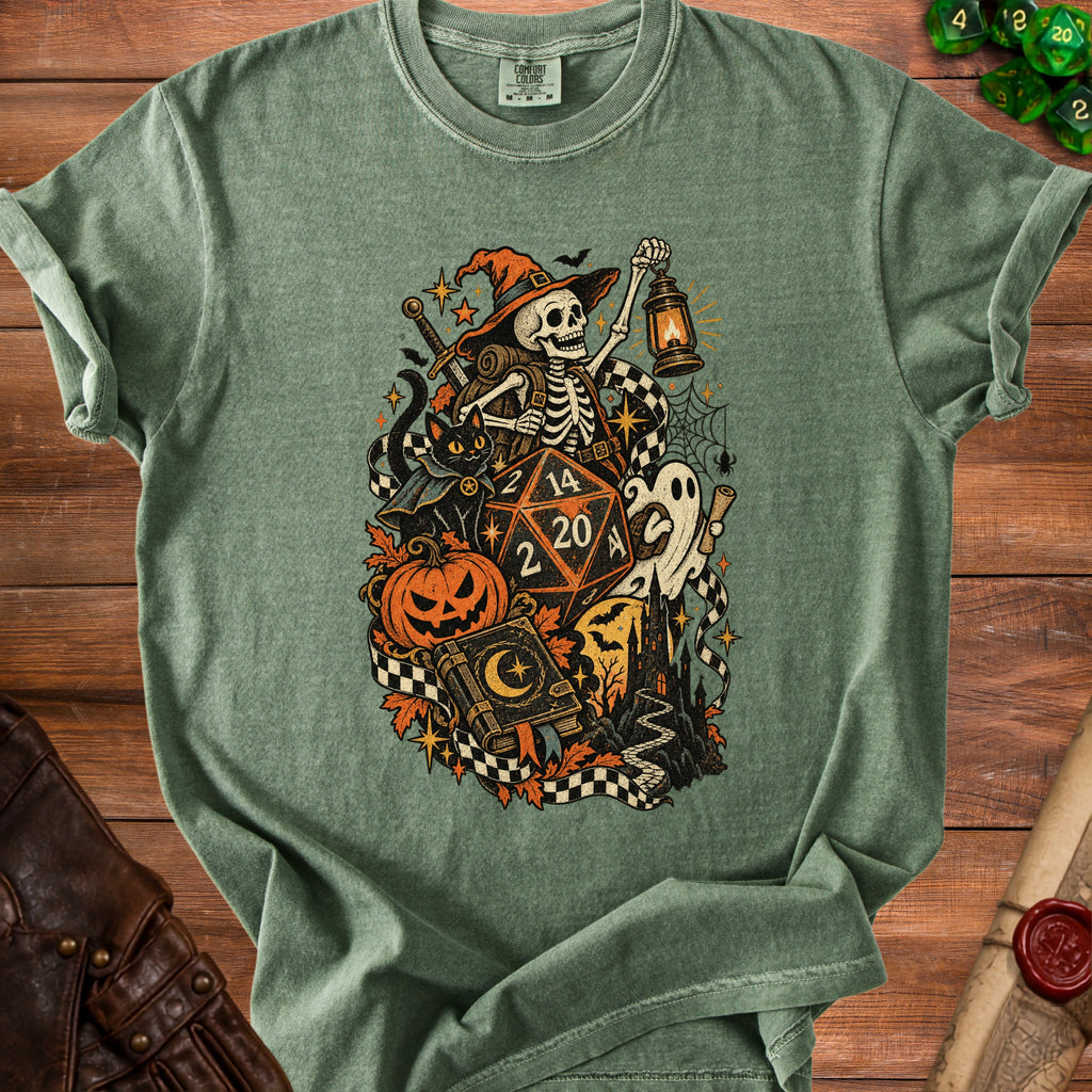 Green t-shirt with skeleton, black cat, dice, and Halloween motifs.
