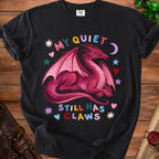 Black t-shirt with pink dragon and text "MY QUIET STILL HAS CLAWS".
