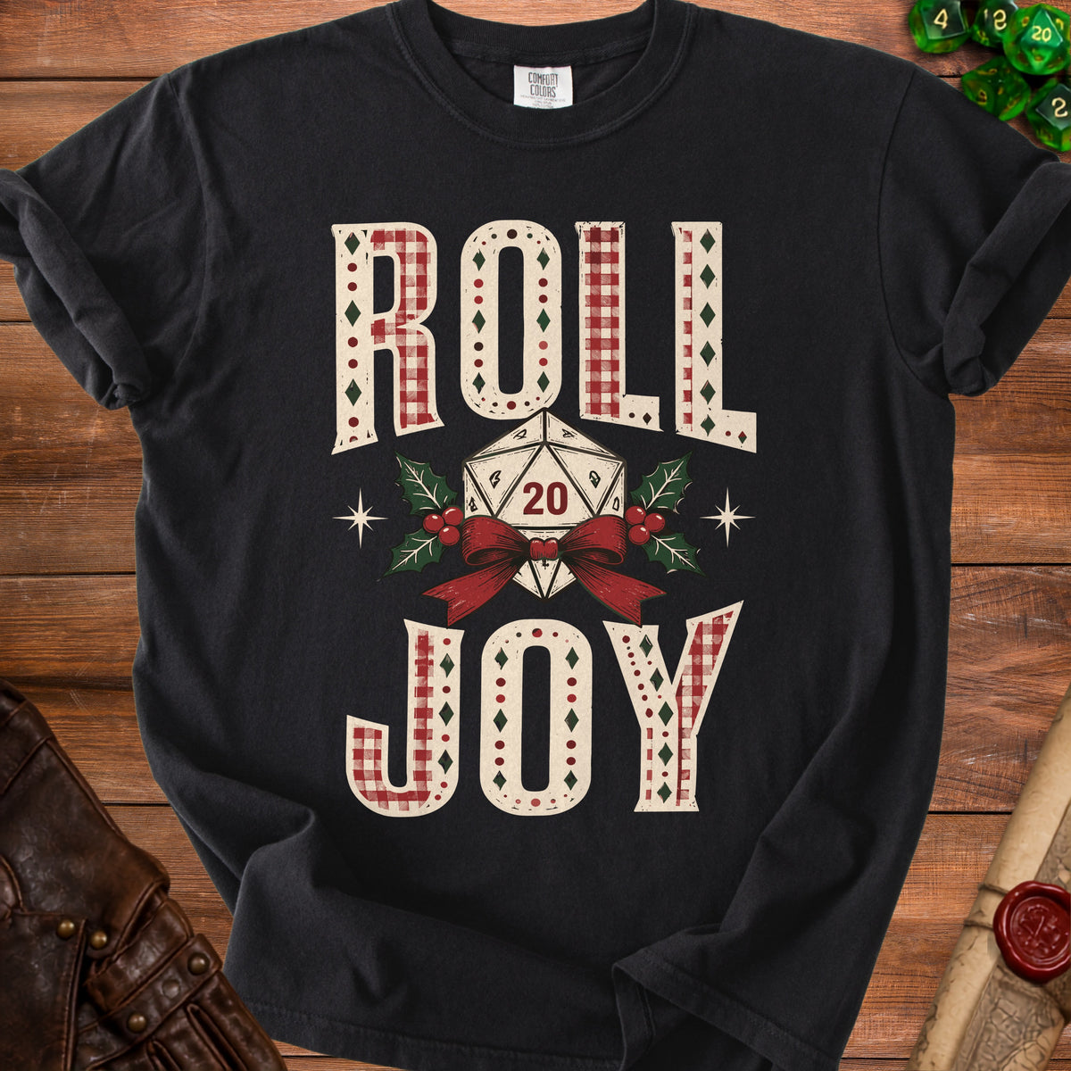 Black t-shirt with "ROLL JOY" text and a D20 dice with holiday accents.