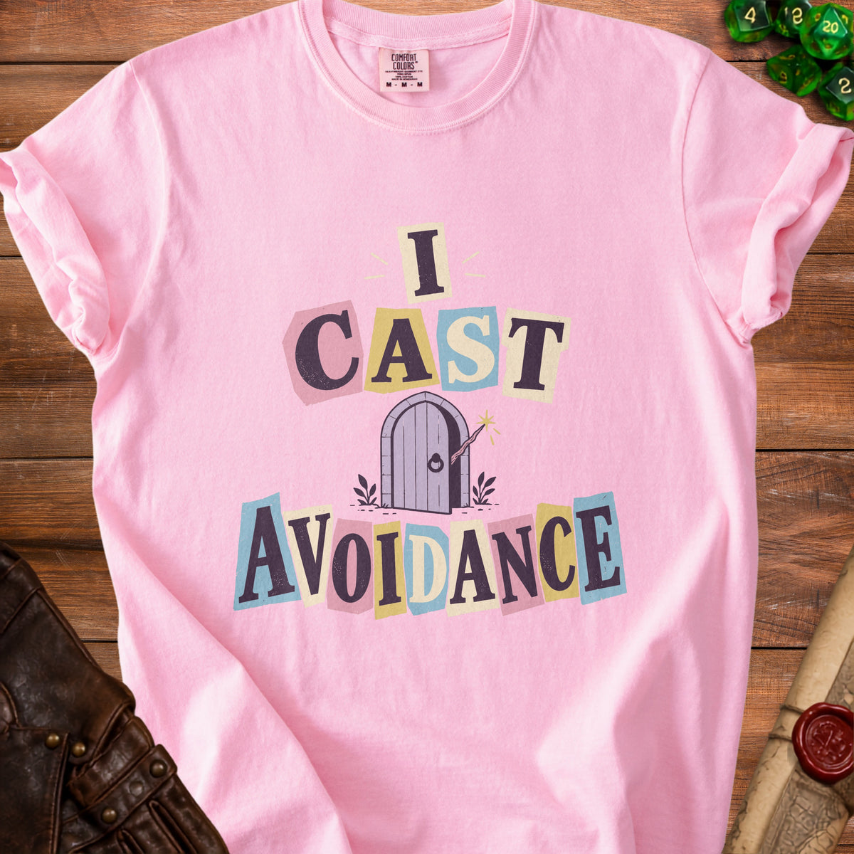 Pink t-shirt with "I CAST AVOIDANCE" text over a door graphic.