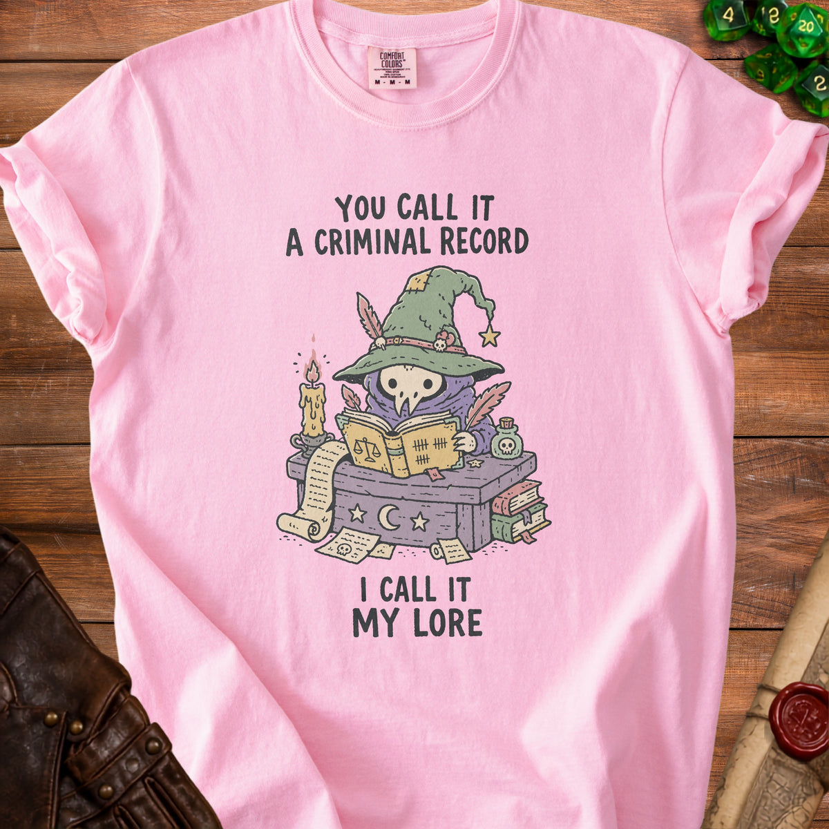 Pink t-shirt with a wizard owl illustration and the text "You call it a criminal record, I call it my lore."