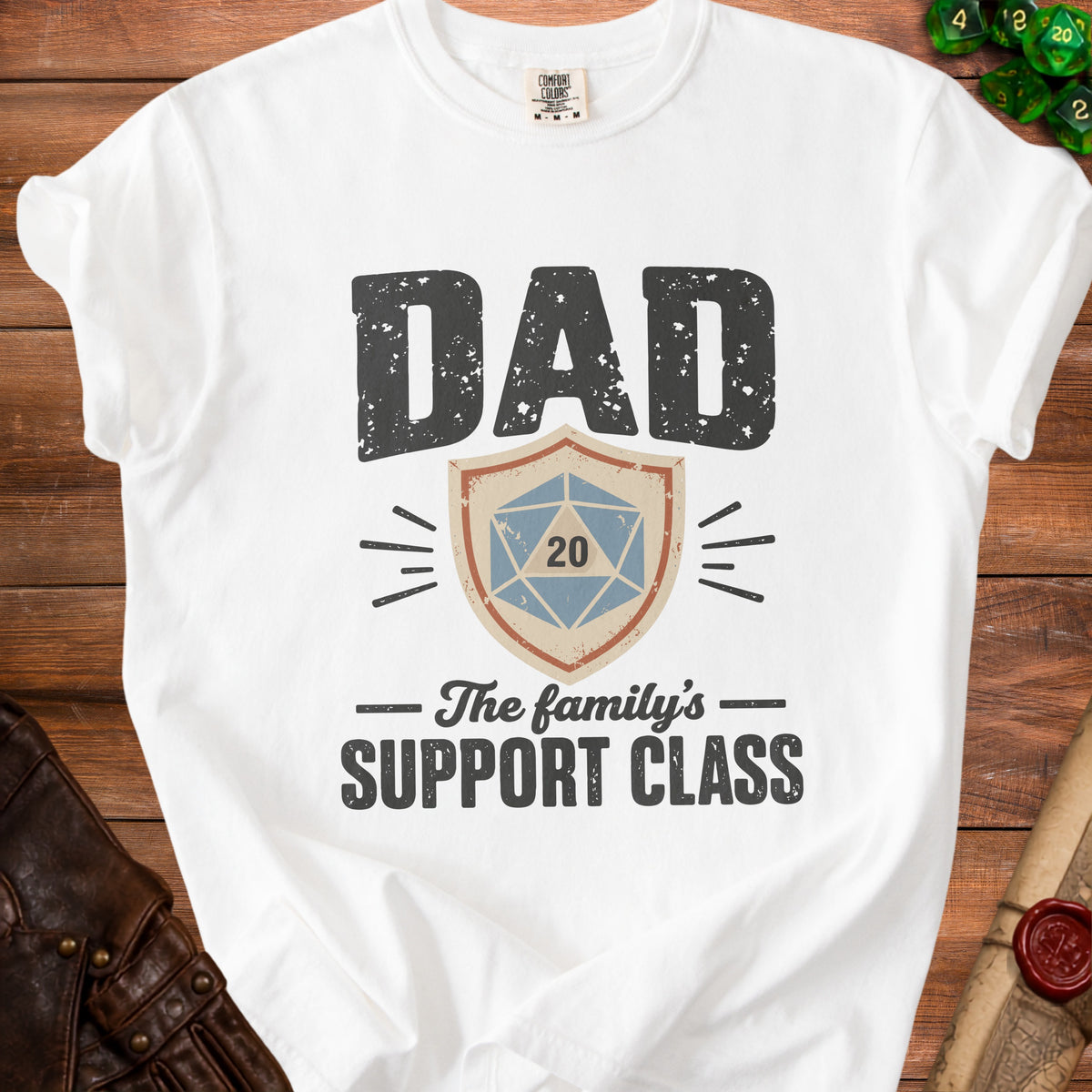 White t-shirt with "DAD The family's SUPPORT CLASS" text and D20 dice graphic.