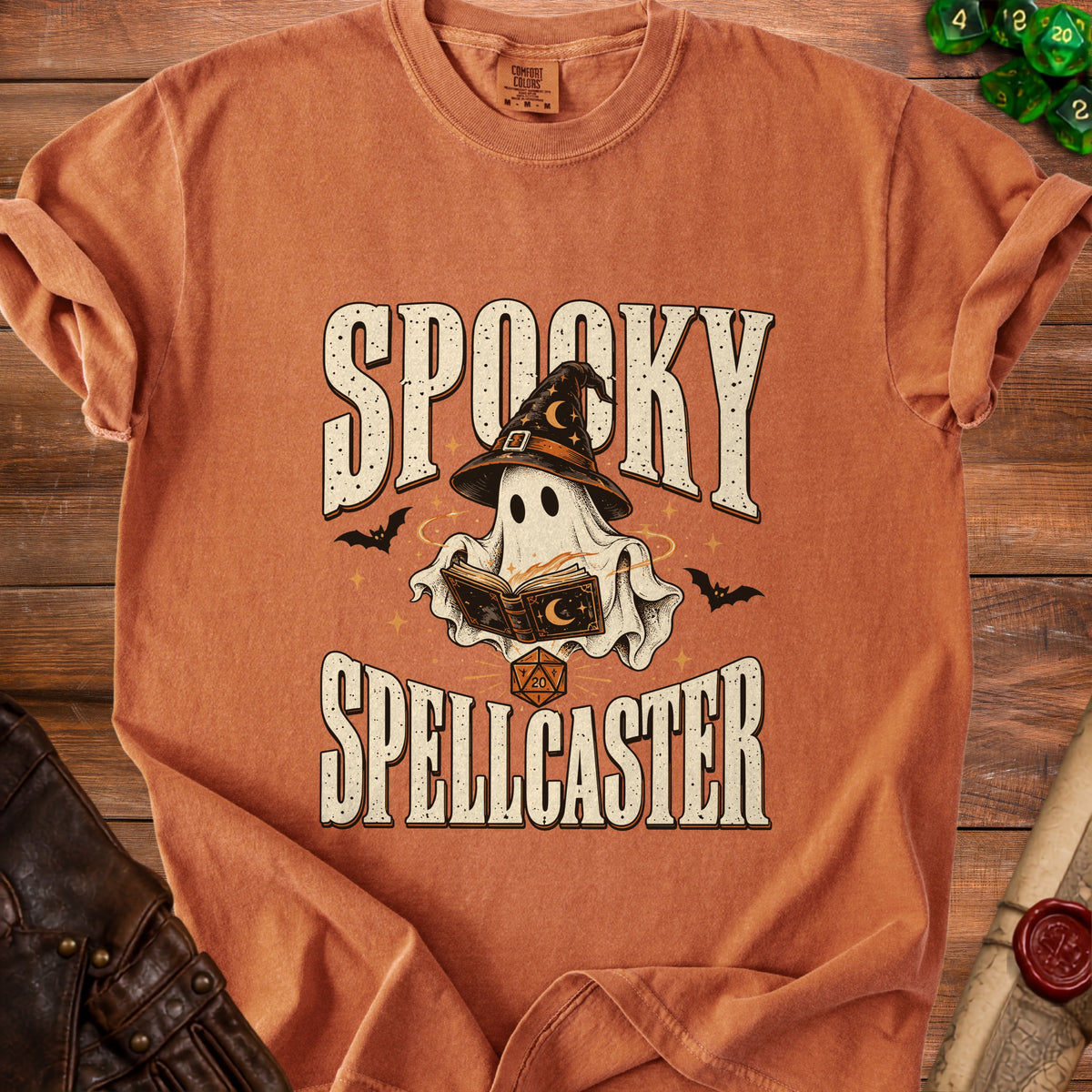 Orange t-shirt with "Spooky Spellcaster" graphic featuring a ghost and spellbook.
