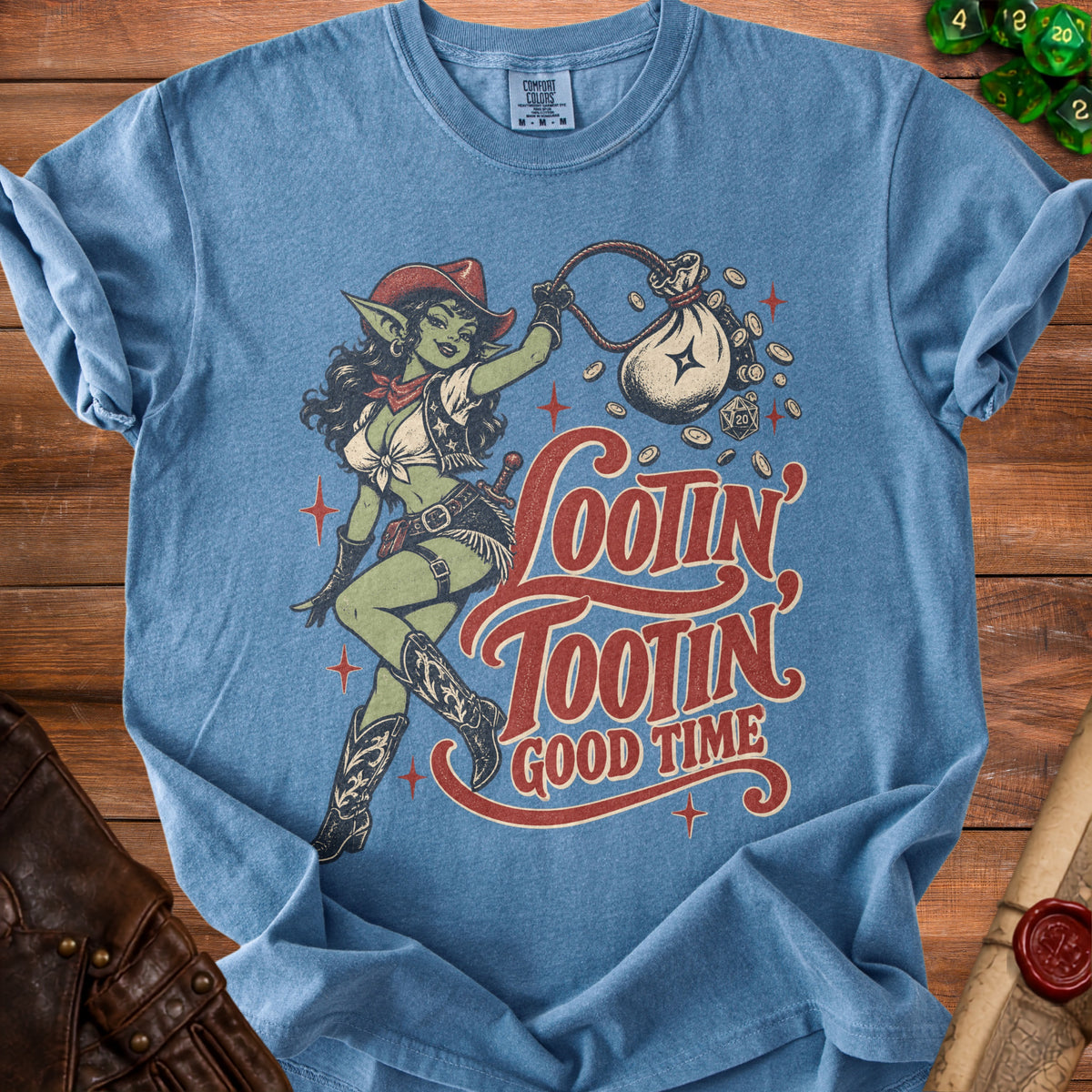 Blue t-shirt featuring a goblin in cowboy attire holding a money bag with text "Lootin' Tootin' Good Time".