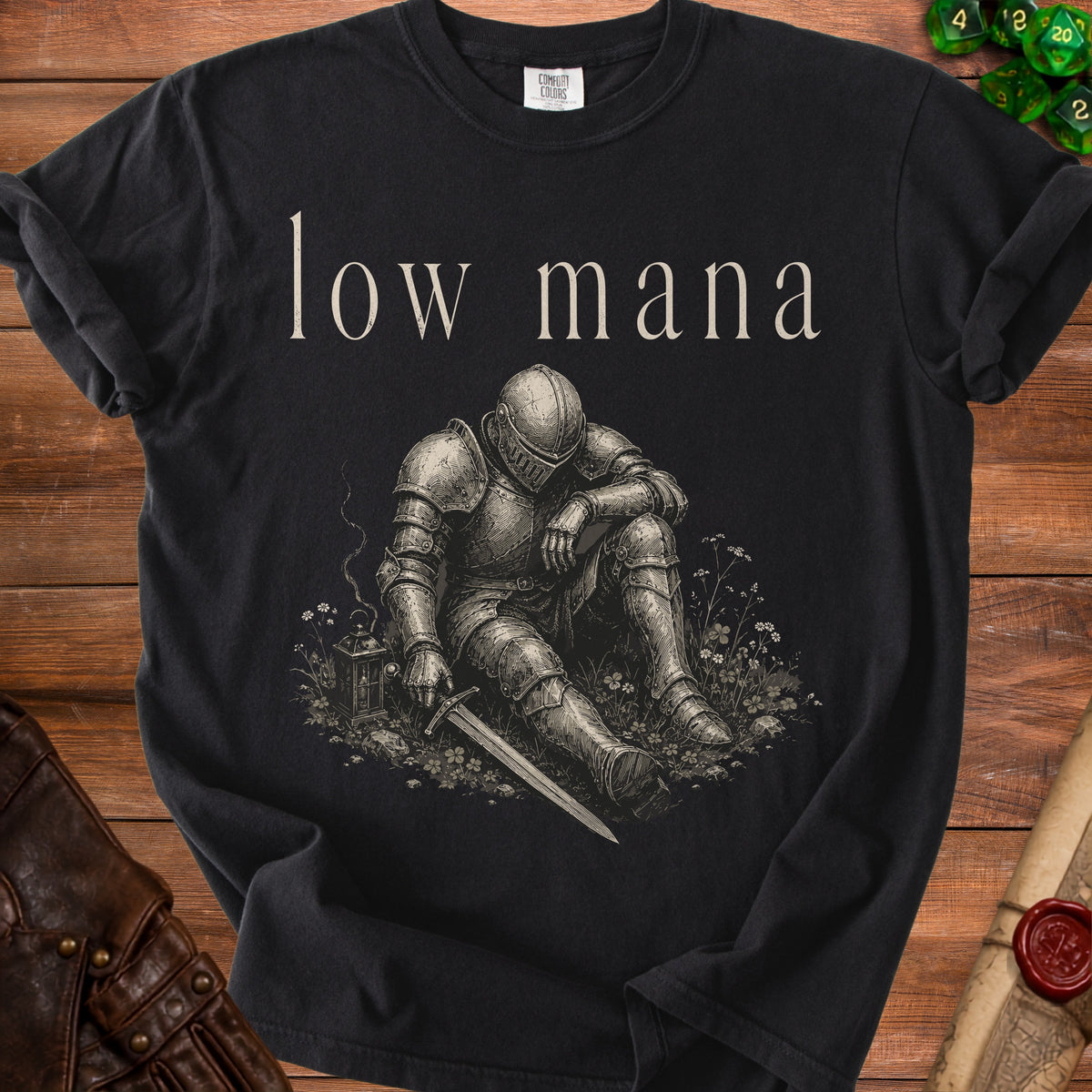 Black t-shirt with "low mana" text and a weary knight in armor.