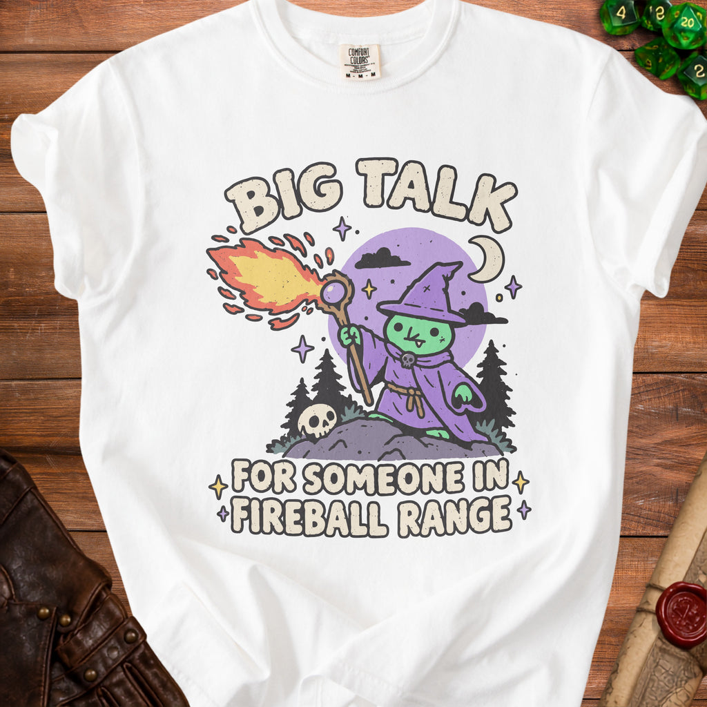 White t-shirt with cartoon witch casting fireball, text "BIG TALK FOR SOMEONE IN FIREBALL RANGE".