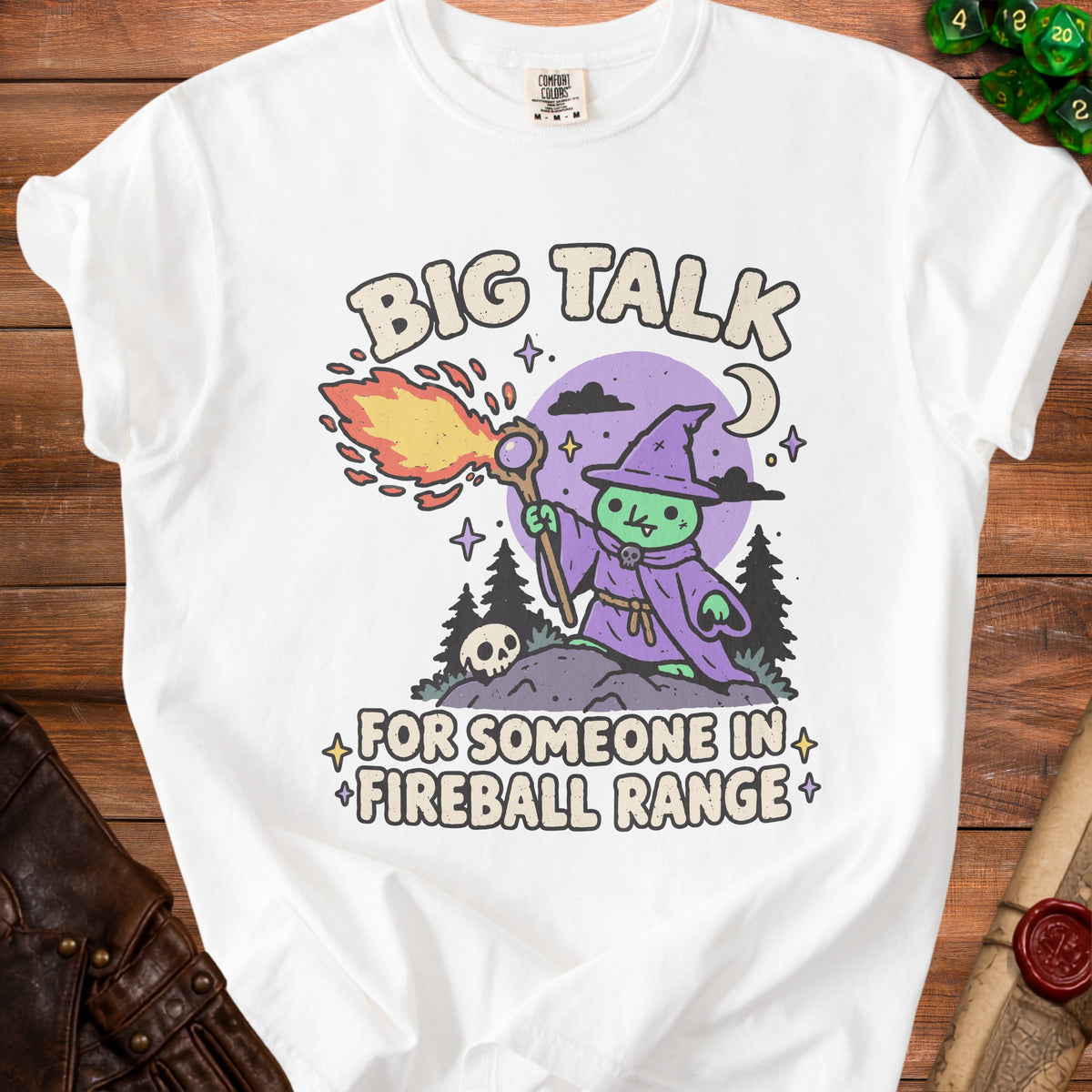 White t-shirt with cartoon witch casting fireball, text "BIG TALK FOR SOMEONE IN FIREBALL RANGE".