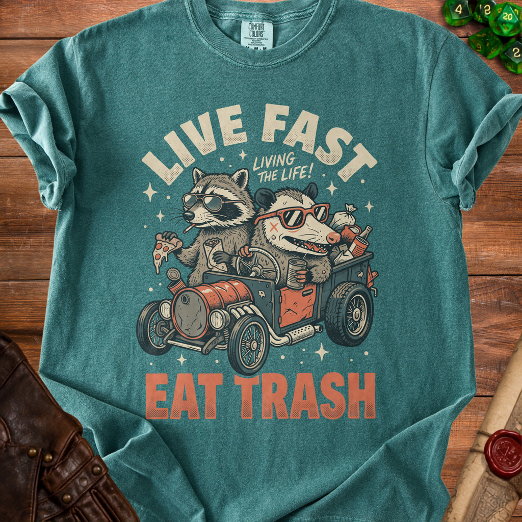 T-shirt graphic of raccoon and possum in a hot rod with text "LIVE FAST EAT TRASH".
