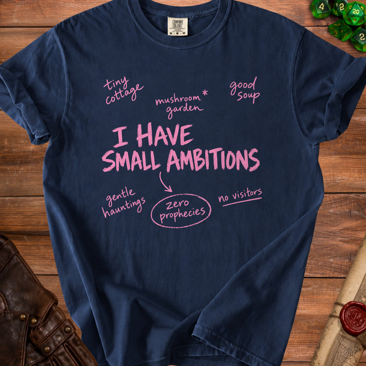 Navy t-shirt with pink text "I HAVE SMALL AMBITIONS" and related phrases.