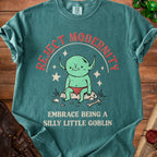 T-shirt with red text "REJECT MODERNITY" and a cartoon goblin reading "EMBRACE BEING A SILLY LITTLE GOBLIN".