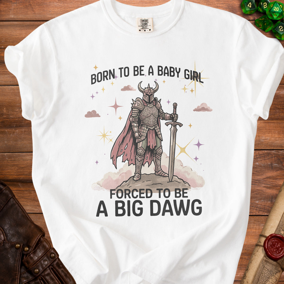 White t-shirt with knight graphic and text "Born to be a baby girl forced to be a big dawg."
