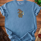 Blue t-shirt with a wizard character holding a coffee mug, Comfort Colors tag.