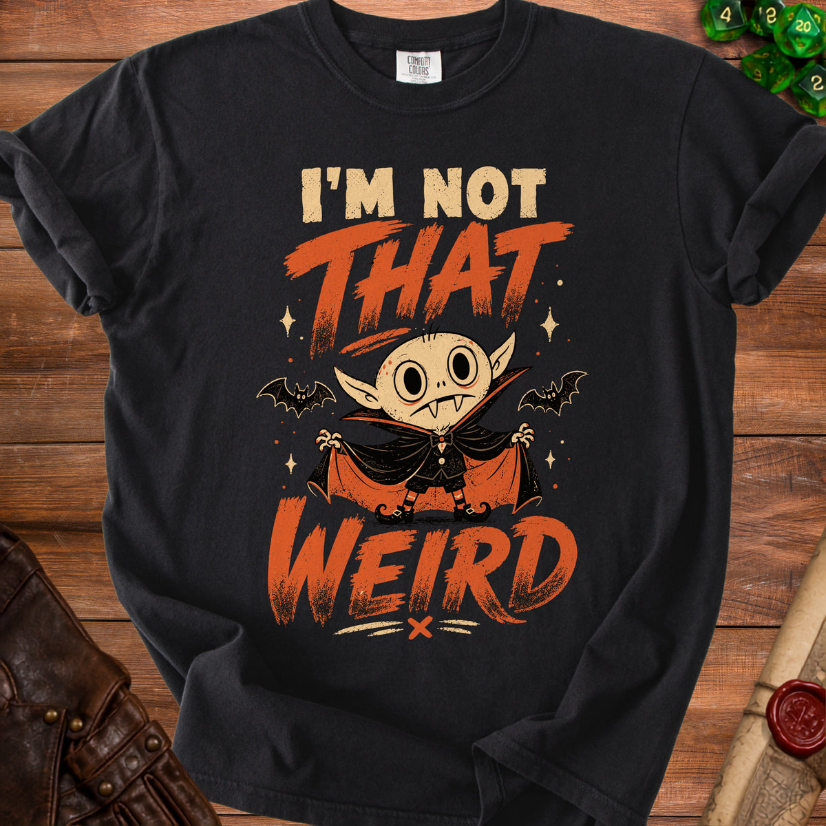 Black t-shirt with cartoon vampire and text "I'm Not That Weird".