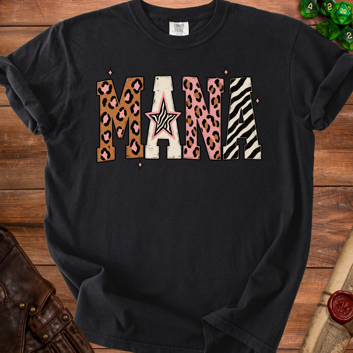 Black t-shirt with "MANA" text in leopard, zebra, and pink patterns with a star.