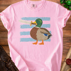 Pink t-shirt with a cartoon duck holding a sword, on a striped background.