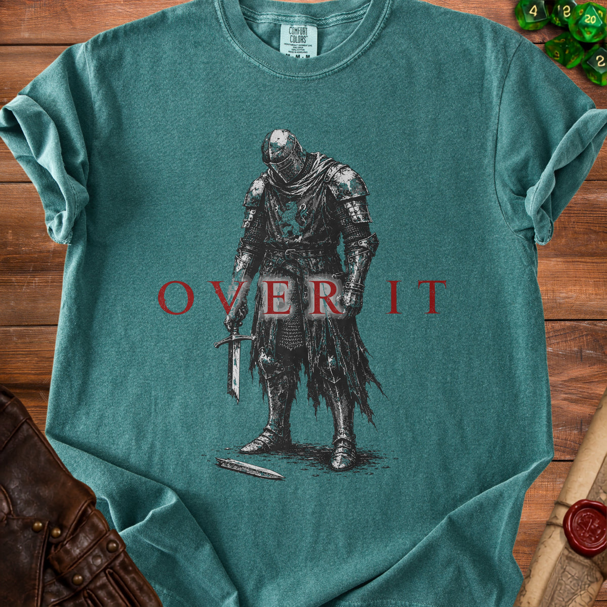 Green t-shirt with graphic of armored knight and "OVER IT" text.