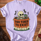 Skeleton in a pot with coffee, "Too Tired to Exist" text, on lavender t-shirt.