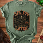Green t-shirt with Grim Reaper in a boat and text "SEE YOU LATER!".