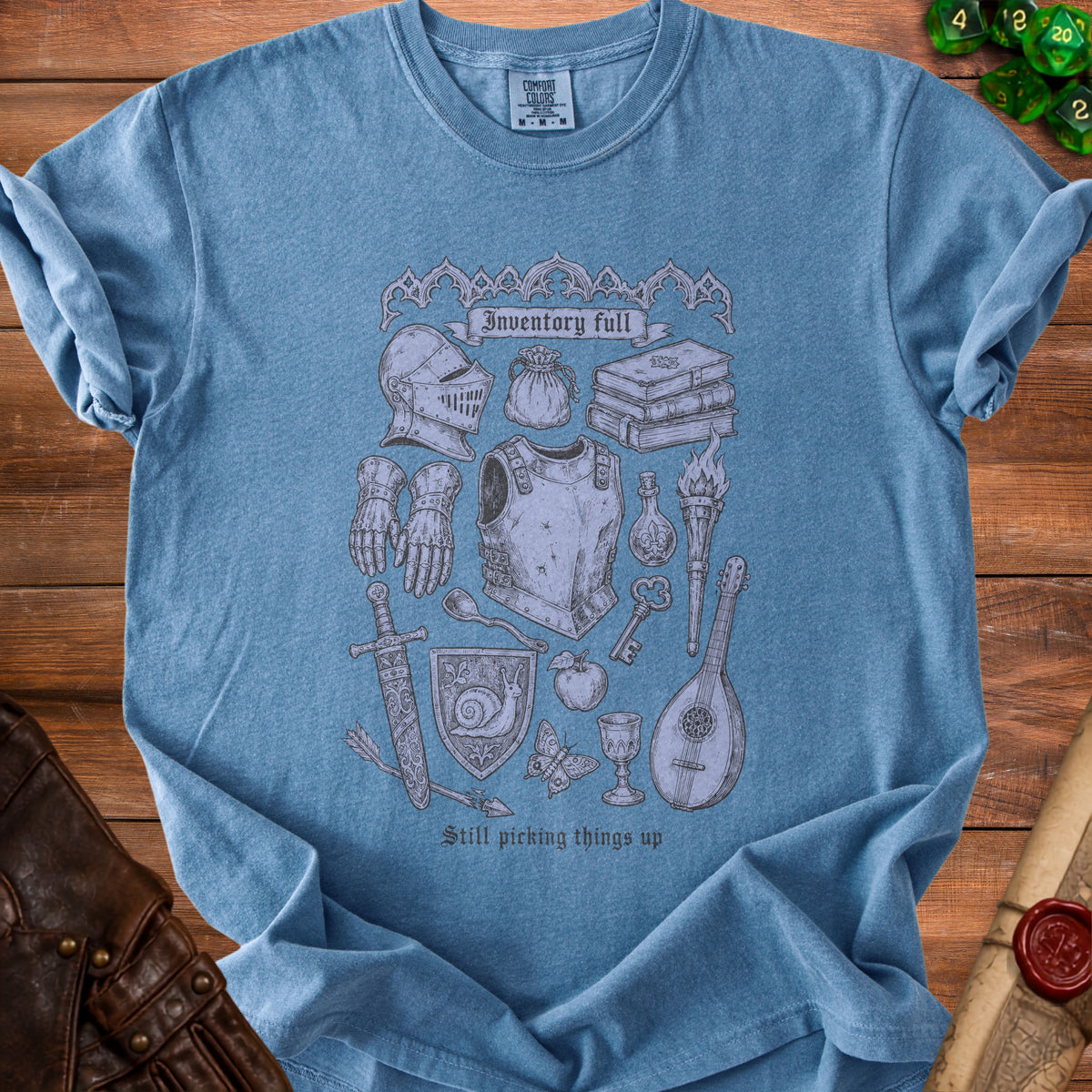 Blue t-shirt with fantasy inventory art and text "Inventory full" and "Still picking things up".