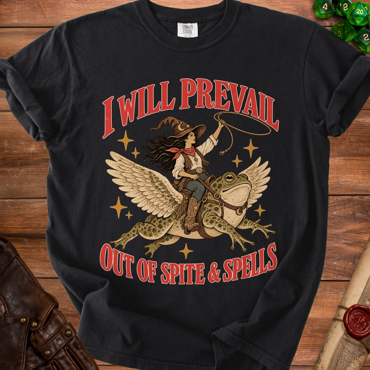 Black t-shirt with "I Will Prevail Out of Spite & Spells" text and witch riding a winged frog.