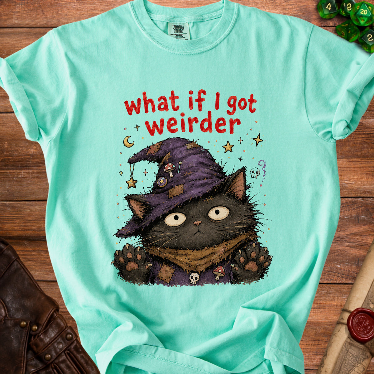 Aqua t-shirt with a black cat wearing a witch hat and the text "what if I got weirder".