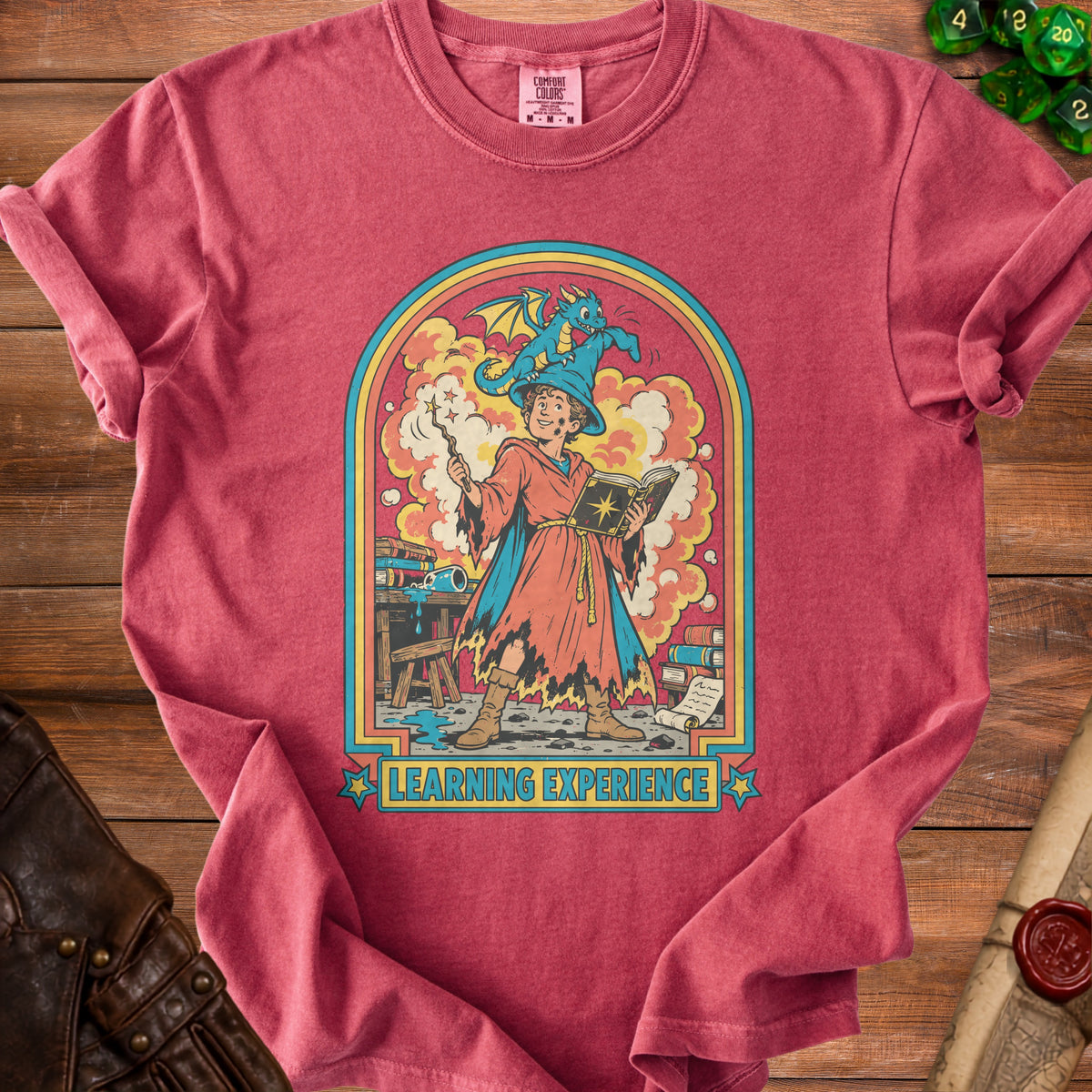 T-shirt with wizard and dragon graphic, text "Learning Experience".
