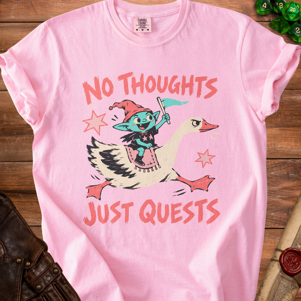 Pink t-shirt with goblin riding goose; text "NO THOUGHTS JUST QUESTS".