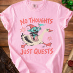 Pink t-shirt with goblin riding goose; text "NO THOUGHTS JUST QUESTS".