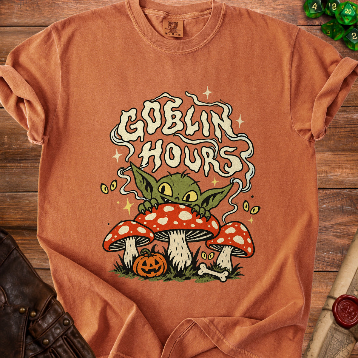 Orange t-shirt with "Goblin Hours" text and a goblin on mushrooms graphic.