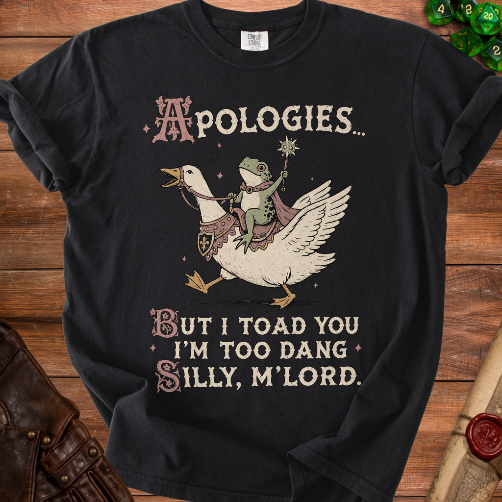Black t-shirt with frog riding a goose saying "Apologies but I toad you I'm too dang silly, m'lord."