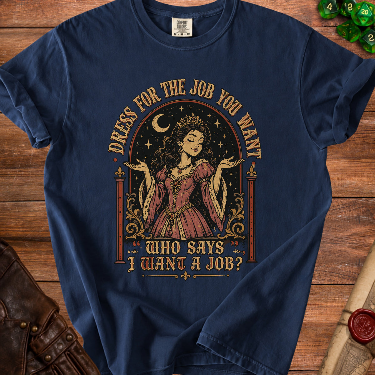 Navy t-shirt with a queen graphic and text "Dress for the job you want, who says I want a job?".
