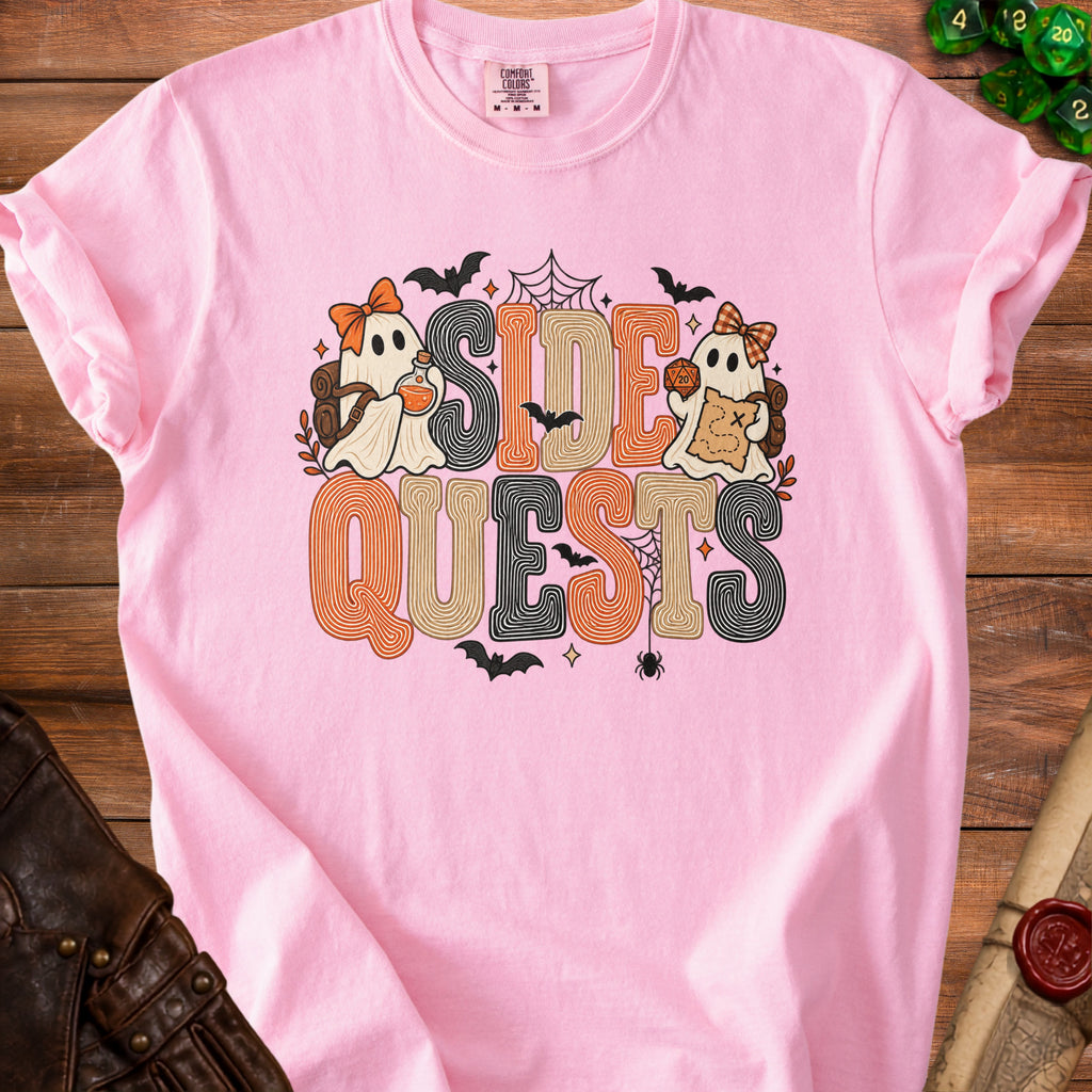 Pink t-shirt with ghosts, dice, and "SIDE QUESTS" text.