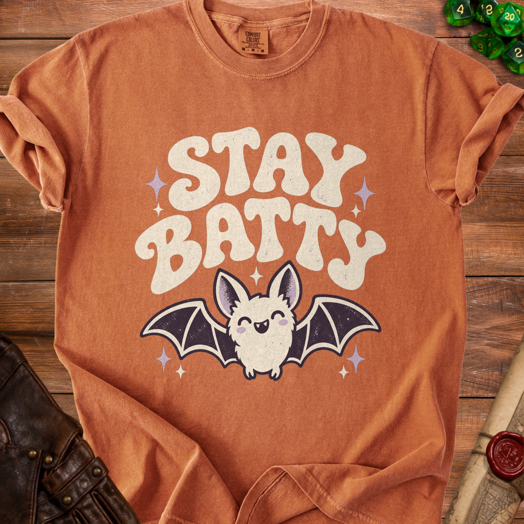 Orange t-shirt with "STAY BATTY" text and a smiling cartoon bat.