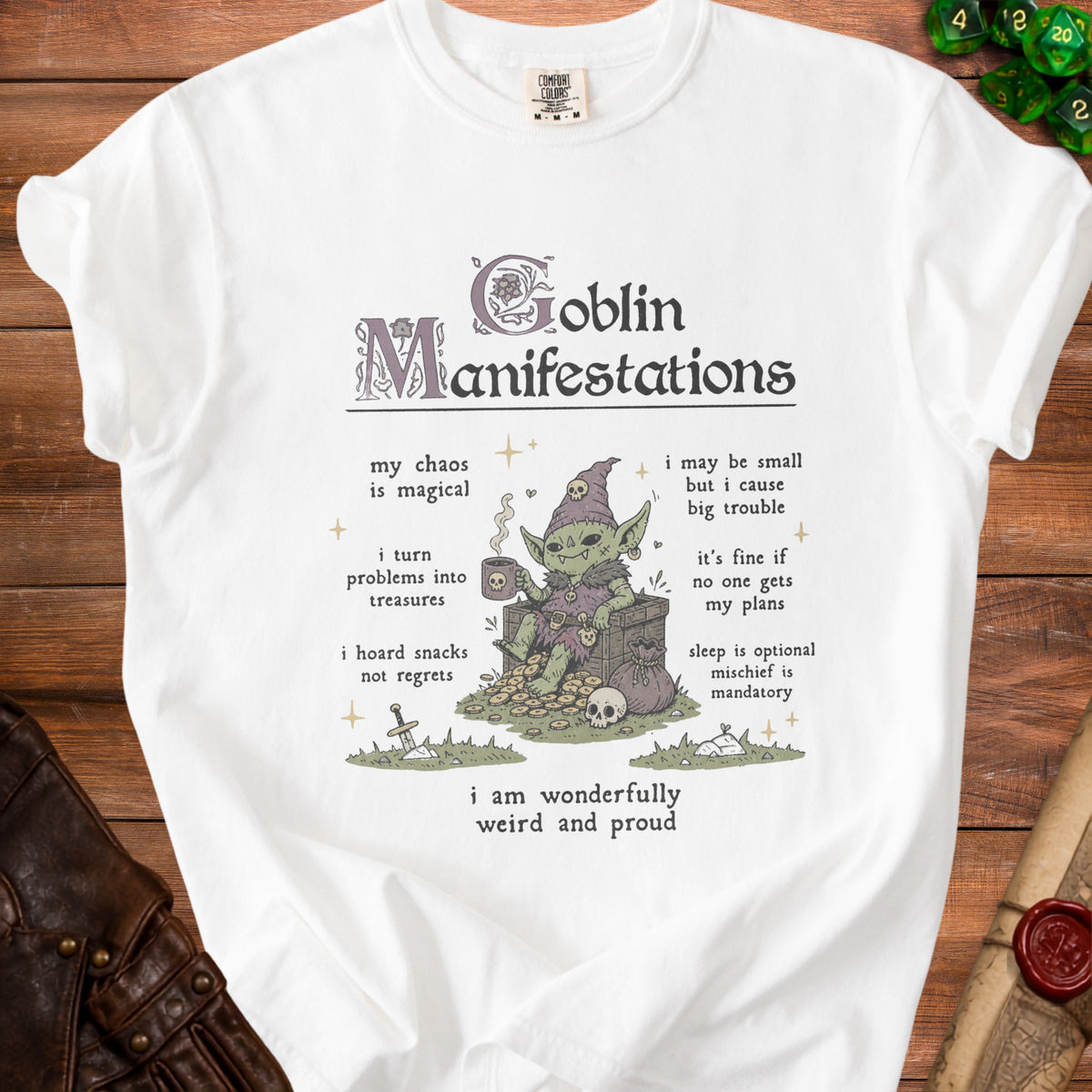 White t-shirt with "Goblin Manifestations" and a drawing of a goblin with text.