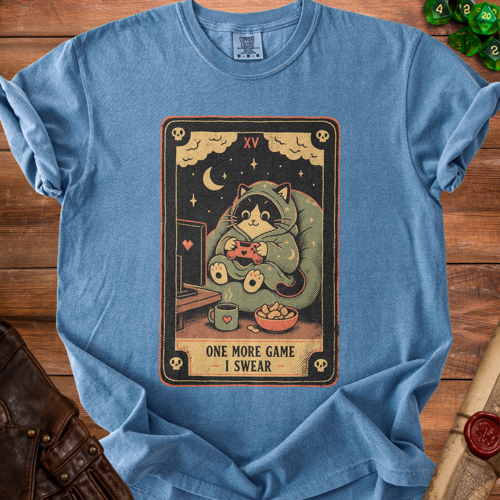 T-shirt featuring a tarot card design of a raccoon playing video games with text.