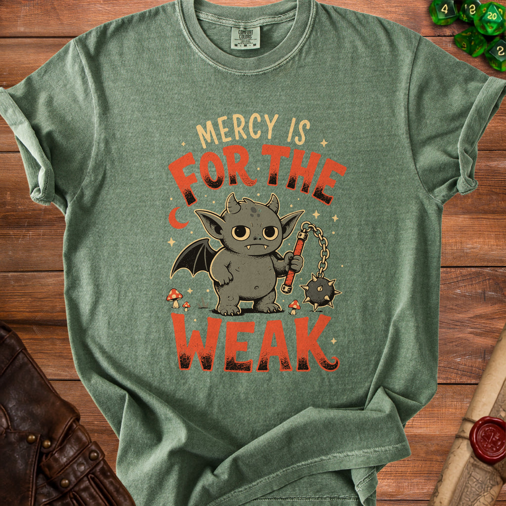 Green t-shirt with a cartoon demon holding a flail, text reads "Mercy is for the weak."