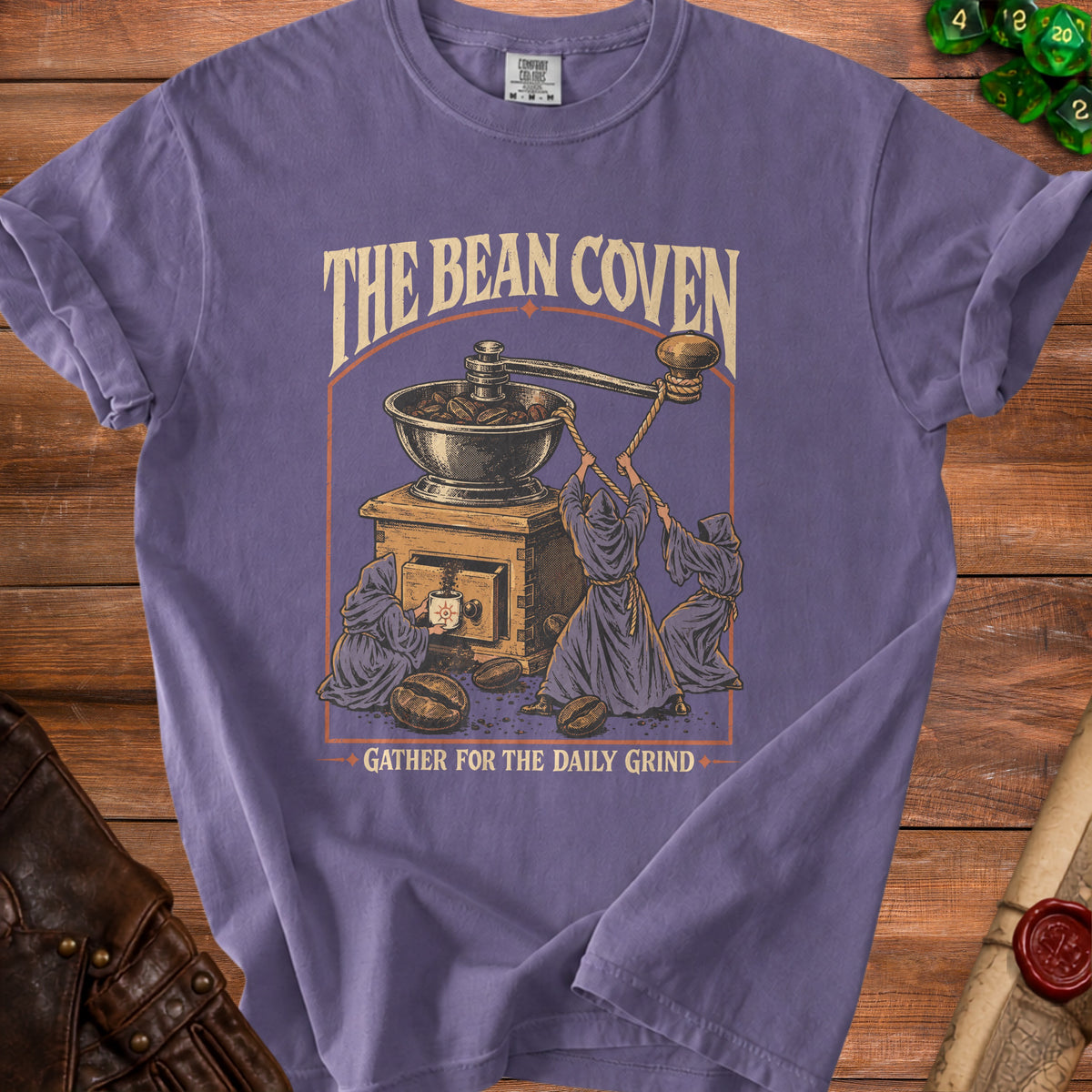 Purple t-shirt with "The Bean Coven Gather for the Daily Grind" graphic.