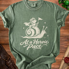 Green t-shirt with white graphic of a knight frog on a snail and text "At a Heroic Pace".