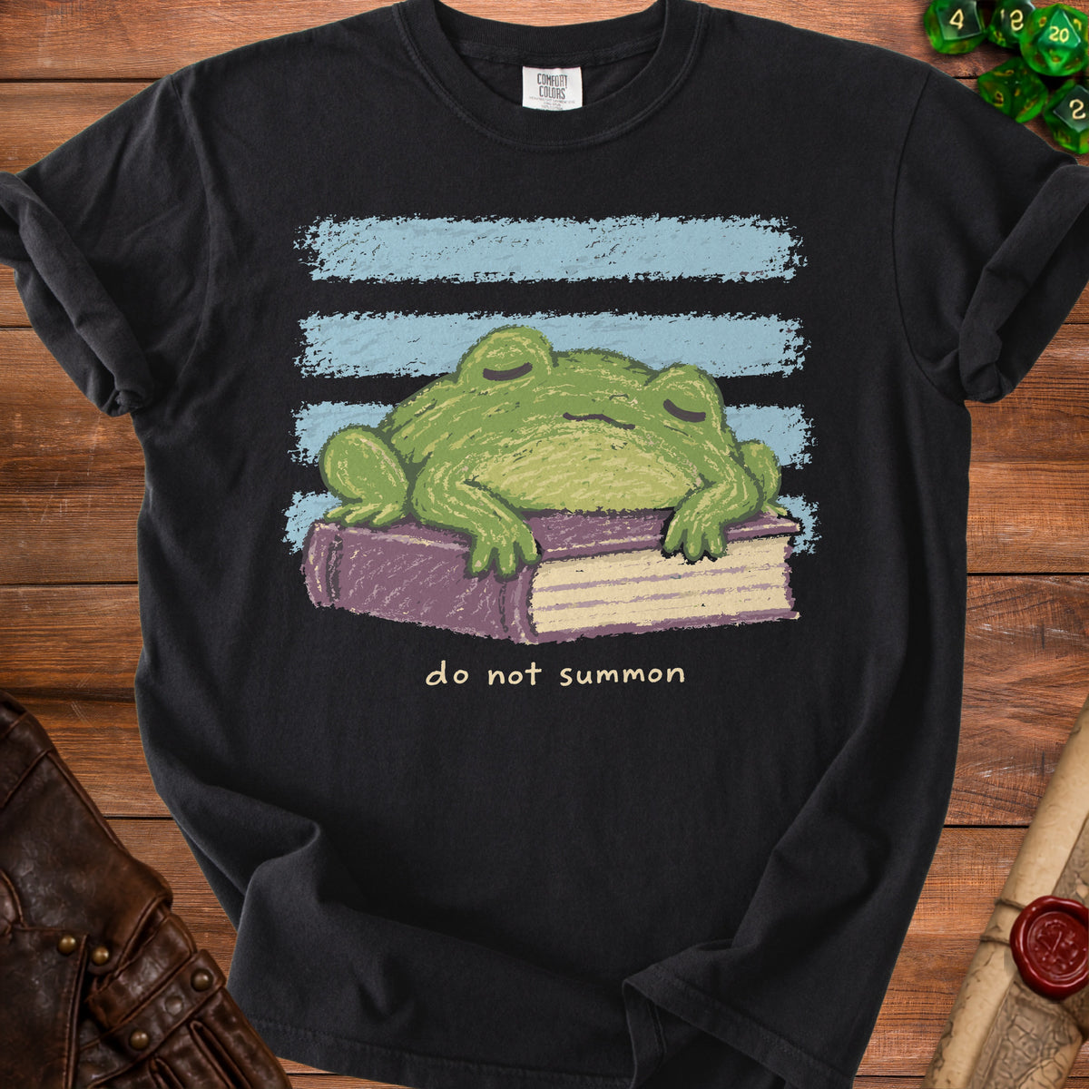 Black t-shirt with a sleeping frog on a book and "do not summon" text.